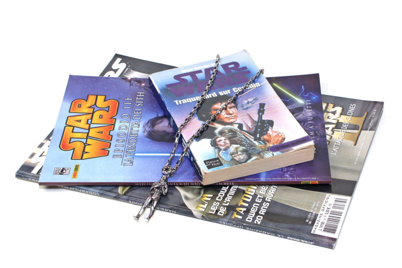 Han Cholo Stormtrooper necklace with International Star Wars books